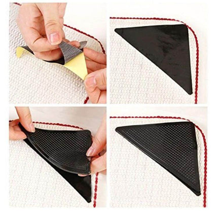 Black Anti-Slip Rug Corner Mats, 4-Piece Set, 15.5x10.5cm shown installed on rug corner to prevent curling and slipping