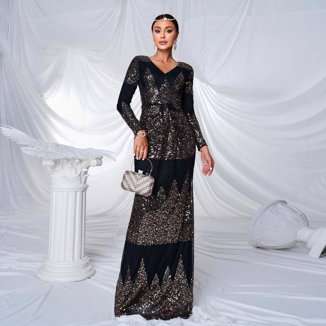 Black Sequined V-Neck Long-Sleeve Evening Dress, Size M model wearing black sequined V-neck long sleeve evening dress with clutch