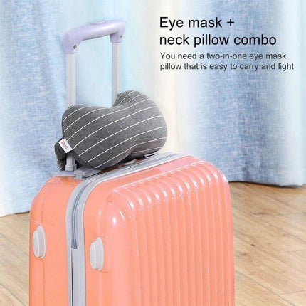 Business Travel Eye Protection Pillow For Restful Sleep shown as a striped rectangular neck pillow and eye mask combo on a carry-on suitcase