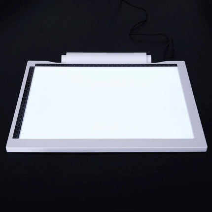 Adjustable Brightness A4 LED Drawing Light Pad for Artists on black background, lit surface for tracing and sketching