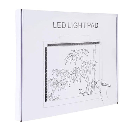 Adjustable Brightness A4 LED Drawing Light Pad for Artists in packaging showing tracing light pad with botanical sketch