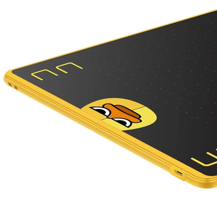 Huion HS64 Graphics Drawing Tablet with Battery-Free Pen in yellow with duck decal, close-up corner and USB-C port