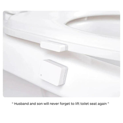 Xiaomi Intelligent Mini Door and Window Sensor for Home Security mounted on a white toilet seat edge showing compact magnetic sensor