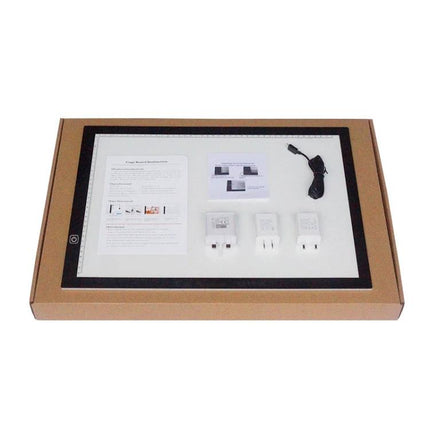 A3 Dimmable Acrylic Sketchpad for Drawing and Tracing laid flat in packaging with adapters and USB cable