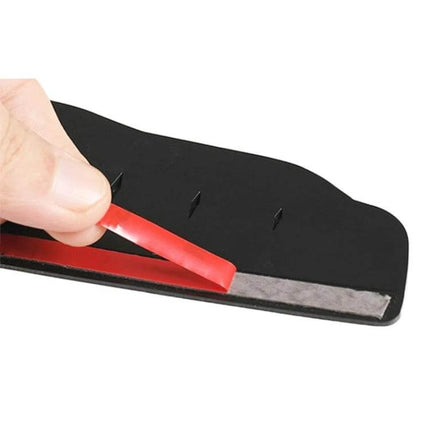 Protective Rear View Mirror Rain Shield with Carbon Fiber Design – hand peeling adhesive strip from black PVC rain shield