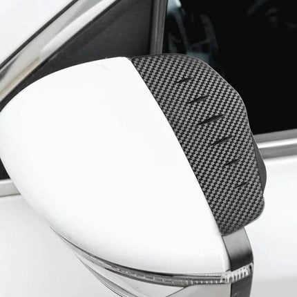 Protective Rear View Mirror Rain Shield with Carbon Fiber Design installed on a white car side mirror, PVC rain guard for clear visibility