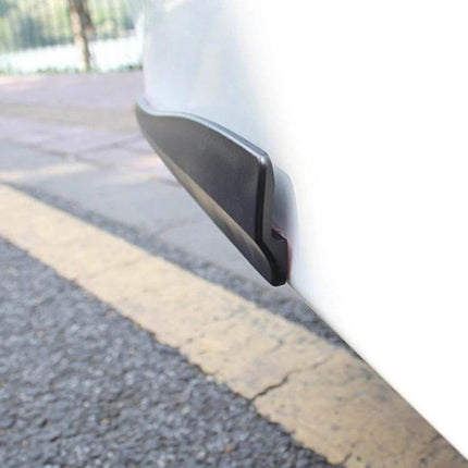 Carbon Fiber Silicone Bumper Strip for Car Door Protection mounted on white car door edge to prevent scratches and dings