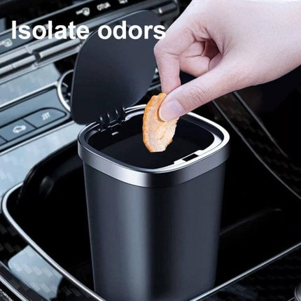 Car Center Armrest Storage Box With Push Lid Trash Can in car cup holder with hand pushing lid to dispose snack, isolates odors, compact durable ABS design