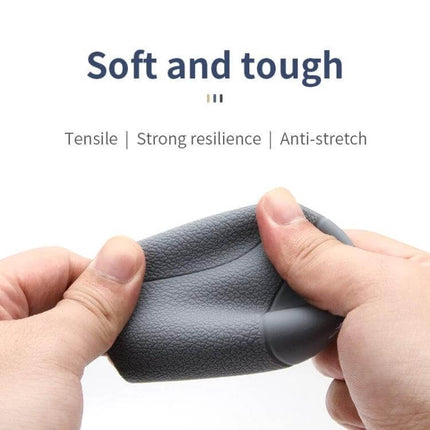 Volkswagen 5-Speed Silicone Shift Knob Cover For Daily Use showing soft, textured silicone stretched by hands to demonstrate grip and resilience