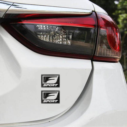 F-Sport Aluminum Alloy Personalized Car Stickers, Type D mini aluminum emblem on white car trunk near taillight