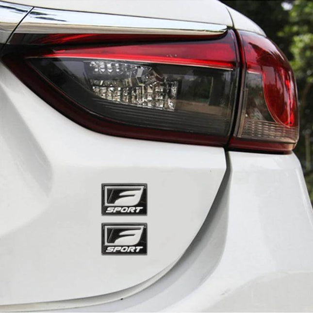 F-Sport Aluminum Alloy Personalized Car Stickers, Type D mini aluminum emblem on white car trunk near taillight