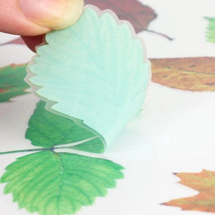 3D Personalized PVC Self-Adhesive Stickers for Car Decoration showing a hand peeling a green leaf-shaped PVC sticker from backing