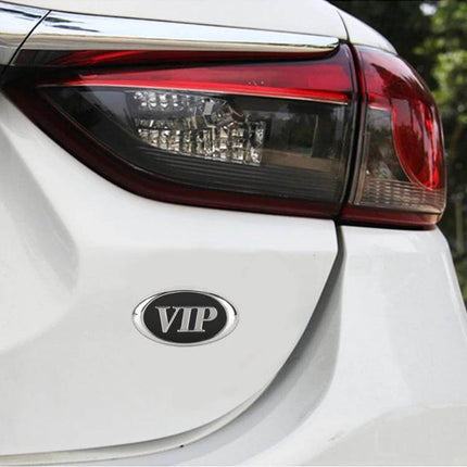 Stylish Oval Metal Personalized Decorative Car Stickers VIP oval metal badge on white car bumper near taillight