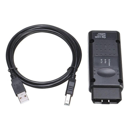 OPCOM Diagnostic Tool for Routine Car Maintenance Checks connected to USB cable for at-home OBD diagnostics and dashboard warning troubleshooting