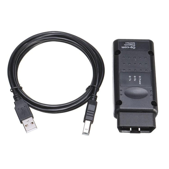 OPCOM Diagnostic Tool for Routine Car Maintenance Checks connected to USB cable for at-home OBD diagnostics and dashboard warning troubleshooting