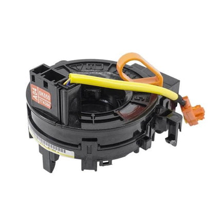 Toyota Corolla Clock Spring Replacement for Steering Wheel - black plastic clock spring assembly with yellow and orange wiring
