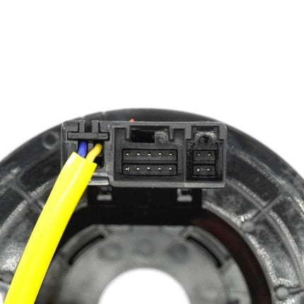 Toyota Corolla Clock Spring Replacement for Steering Wheel seen from connector side, lightweight plastic unit with yellow airbag wiring