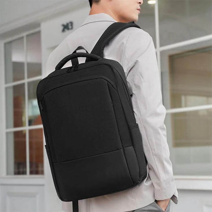 Oxford Laptop Backpack With Trolley Strap For Daily Commute black commuter backpack shown on shoulder