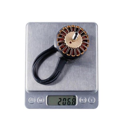 iFlight XING Series Motor for X-Class FPV Racing Drones shown on a digital scale weighing 20.68g highlighting lightweight construction