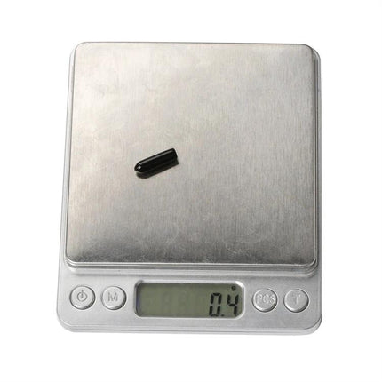 iFlight M3x15mm Antenna Protection Cap for FPV RC Models on a scale showing 0.4g, single black protective cap for M3x15mm motors