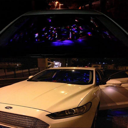 Colorful Car Atmosphere Light, Sound Activated DJ Decor With 6 RGB LEDs shining blue and purple inside white sedan interior via USB