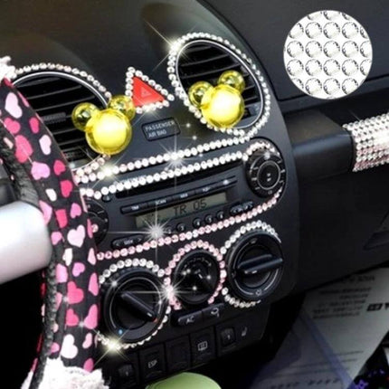 Glitter Rhinestone Stickers for Car, Phone, and Laptop Decor applied to car dashboard vents, stereo and steering wheel for sparkling personalized interior