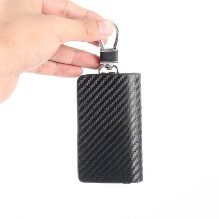 Leather Wallet with Carbon Fiber Texture for Keys and Cards held by hand with keyring, compact black grippy leather organizer