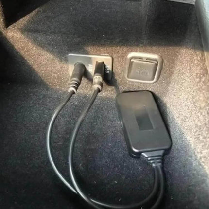 Universal Car Bluetooth AUX Audio Adapter Cable For In Car Audio plugged into USB and AUX ports showing Bluetooth adapter and cables