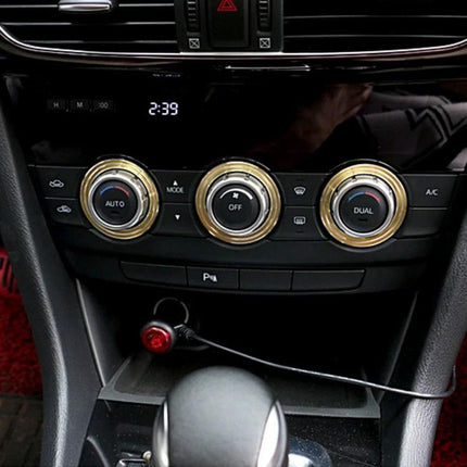 Set of 3 Aluminum Air Conditioner Knob Covers for Mazda ATENZA installed on dashboard, gold finish protecting and refreshing knobs