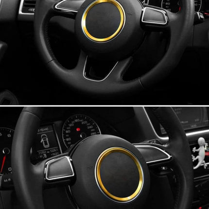 Aluminum Steering Wheel Decoration Ring for Audi Vehicles installed on black Audi steering wheel with gold center ring accent