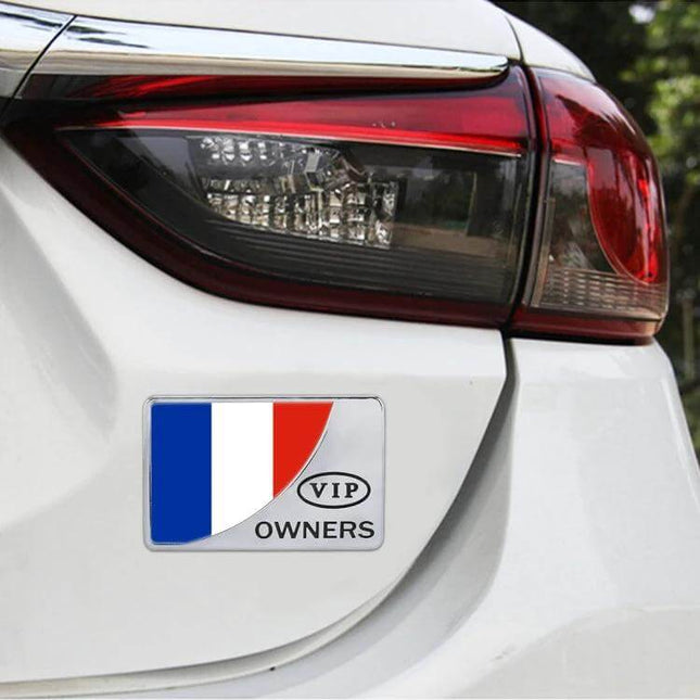 Decorative Metal Rectangle France Flag Sticker for Automobiles on white car rear bumper, durable metal 4.6x7x0.5cm, shows tricolor design and VIP owners text