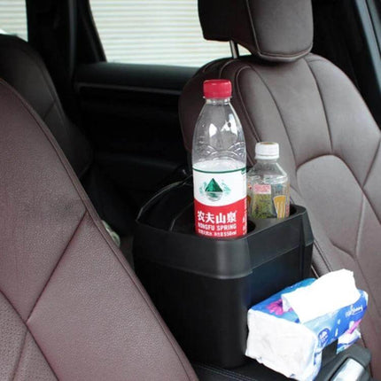 Shunwei Multifunction Car Cup Holder and Trash Bin Organizer shown between seats holding water bottles and tissues