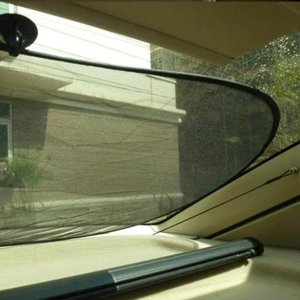 Foldable Car Window Shade for Blocking UV Rays in Back Seats installed on a minivan back window protecting rear passengers from sun glare
