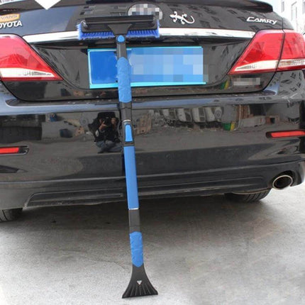 Extendable Car Snow Brush with Ice Scraper and Squeegee for Winter Use - blue telescoping brush leaned against a black sedan clearing snow and ice