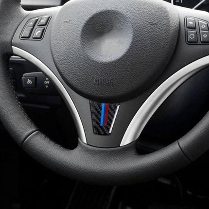 Decorative Carbon Fiber Steering Wheel Sticker for BMW Vehicles applied to BMW steering wheel center with carbon fiber and tri-color stripe