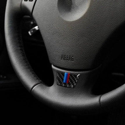 Carbon Fiber Steering Wheel Decorative Sticker for BMW Vehicles on black E90/E92 steering wheel center with carbon fiber M stripe accent