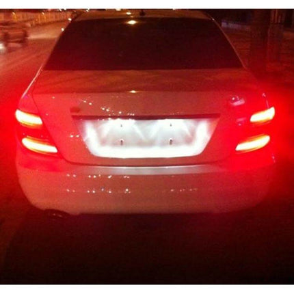 Car Brake Light White For Daily Driving And Safe Stops on a white sedan rear enhancing nighttime visibility for safe following distances