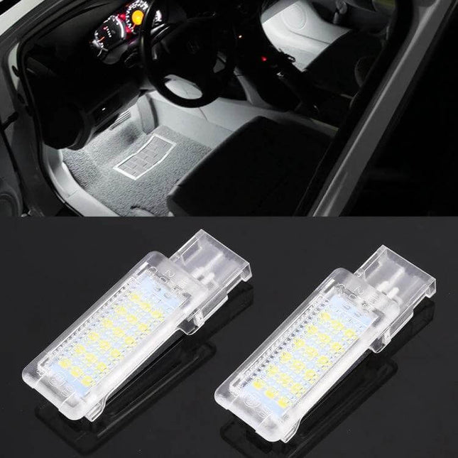 Car Footwell Lights, 2-Pack 12V LED Footwell Lamps For Volkswagen installed under driver footwell showing bright white illumination and two LED modules