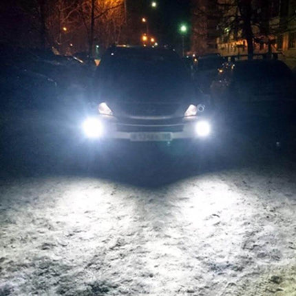 White Car Fog Light 2 Pack For Everyday Night Driving - bright white fog lights improving visibility on snowy suburban road at night