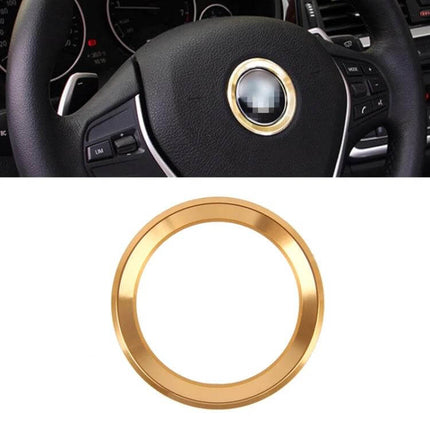 Aluminium Alloy Decorative Steering Wheel Ring Cover for BMW Cars installed on black BMW steering wheel, gold finish, protects wheel and adds subtle decoration