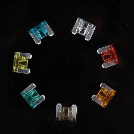 Mini Add-A-Circuit Fuse Tap Adapter 100-Pack For Vehicles - close-up of colorful ATM mini blade fuses on black background