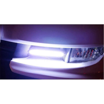 2 Pack Car DRL Light Bar Waterproof White Daytime Running Light installed on car bumper showing bright white COB LED beam, aluminum housing, waterproof design