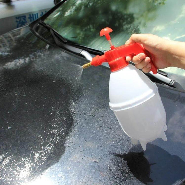 KANEED 1.5L Hand Pump Sprayer for Gardening and Cleaning being used to spray cleaning solution on a car hood