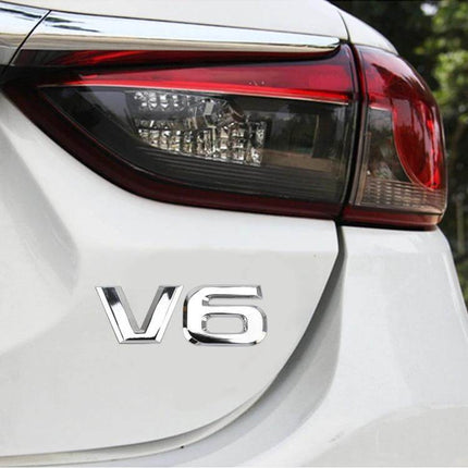 Decorative Metal V6 Shaped Sticker for Car Body Use on white car trunk near tail light, chrome engine-inspired emblem easy-apply finish