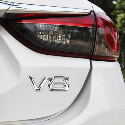 V8 Connect Shape Black Metal Decorative Sticker for Cars on white car near taillight, durable 7.6x3x0.3cm lightweight accent