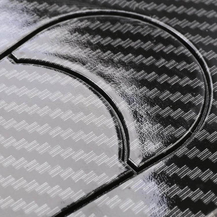 Car Imitation Engine Lock Body Decorative Stickers, 2-Pack - close-up of plastic engine lock-style dashboard stickers on carbon fiber pattern surface