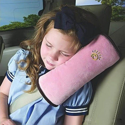 Soft Neck Support Pillow for Baby Car Seatbelts, 2 Pack - pink plush seatbelt pillow cradling sleeping child with removable washable cover