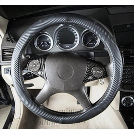 Mercedes-Benz Carbon Fiber Steering Wheel Button Decor Stickers, 2 Pack applied to steering wheel buttons showing carbon fiber texture
