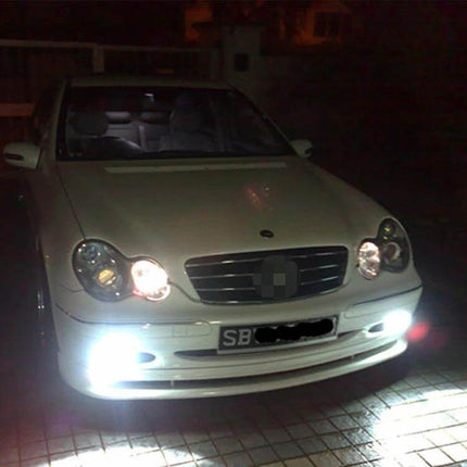 LED Car Fog Lights 2 Pack for Fog Light Replacement installed on white sedan showing bright white fog beam at night