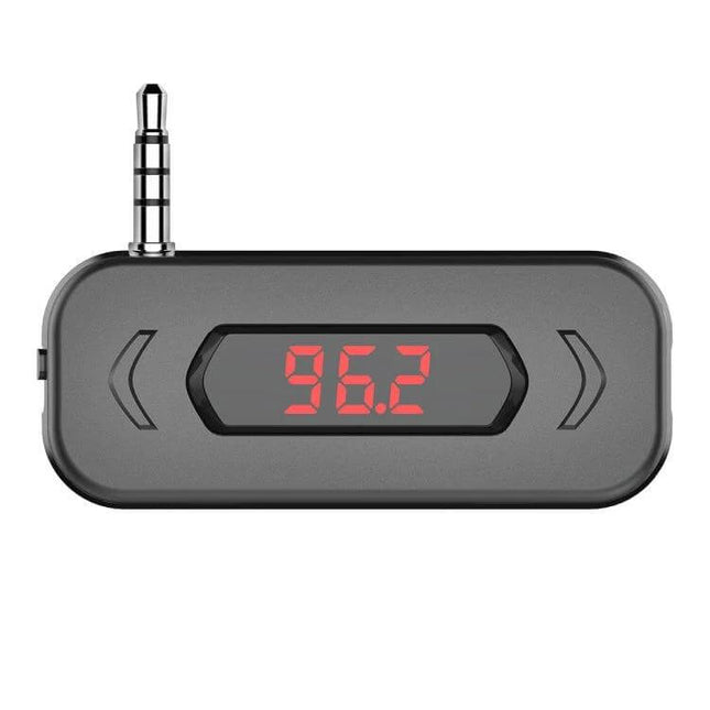 Car FM Transmitter With LCD Display For In Car Music - compact 3.5mm plug transmitter showing 96.2 on red LCD display, PLL stable FM streaming